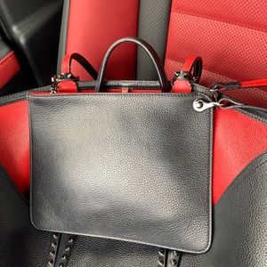 Christian Louboutin leather wristlet.